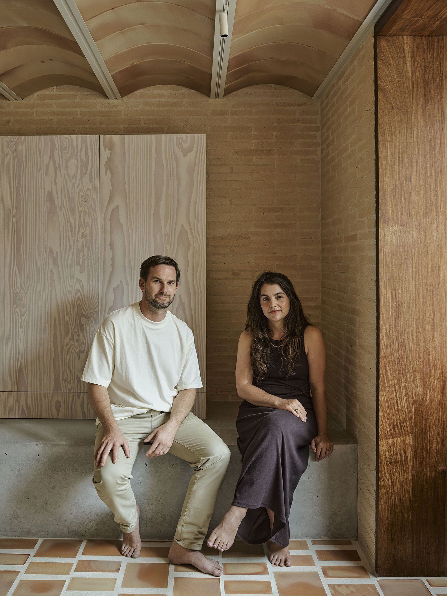 Muci directors Chris Mullaney and Steani Cilliers seated in the Clay House interior.